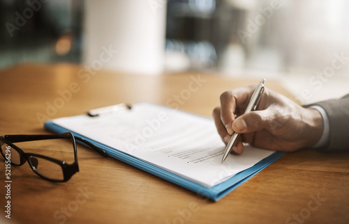 Lawyer hand showing paperwork for signing, agreement contract and settlement offer in law firm office. Closeup of legal advisor, attorney and paralegal pointing with pen to accept or close court case photo
