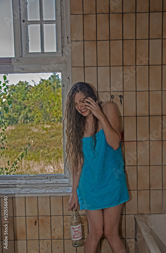 Disappointed Hysterical Young Woman Screaming and Holding a Bottle of Poison