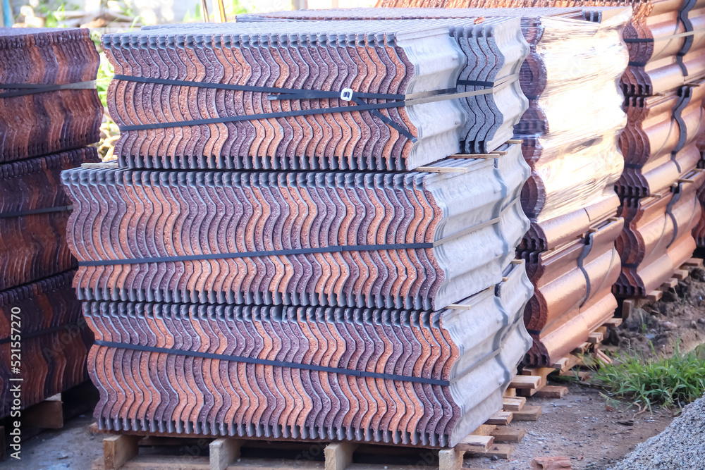 Roof tiles big pile on ground background in construction site