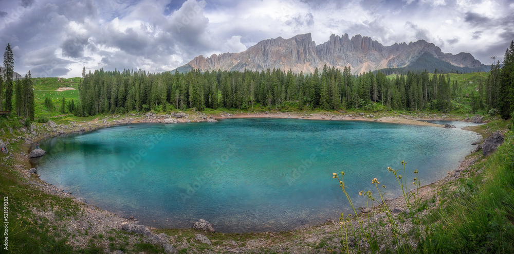 Beautiful panorama view of Lake Carezza, (Italian: Lago di Carezza), one of the classic tourist destinations in the Dolomites in South Tyrol at Italy.