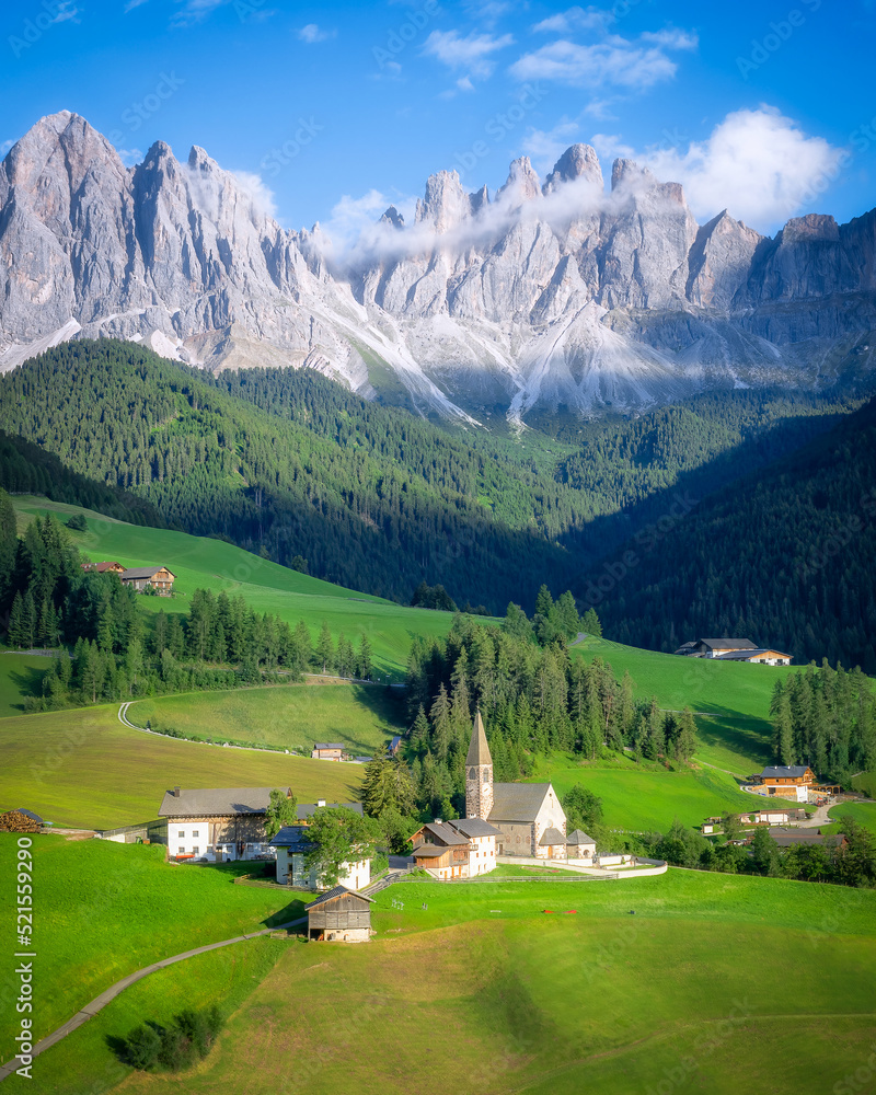 Beautiful view of Santa Magdalena village with Dolomite mountains as background in Italy in summer time. It is the popular destination for tourist travelling.