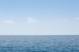 A view of a simple ocean landscape  with a blue sky.