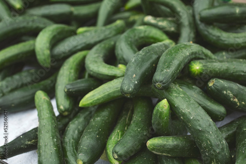 A view of a pile of Japanese cucumbers, on display at a local farmers market.