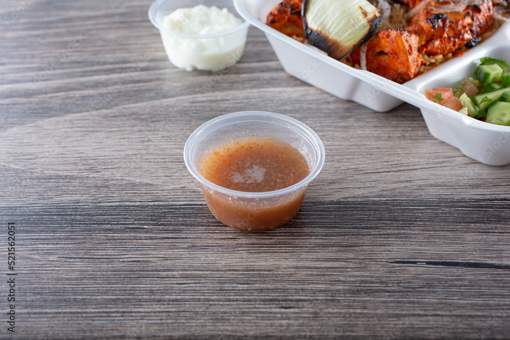 A view of a condiment cup of shatta.