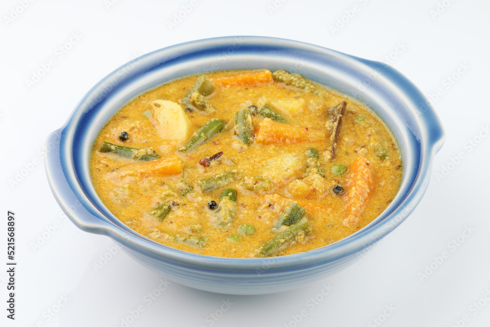 Kerala food -indian food spicy mixed vegetable curry Mix vegetable kurma - Indian recipe contains Carrots, cauliflower, green peas and beans, baby corn traditional