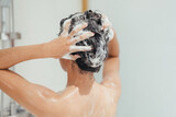 Woman Washing Hair with Shampoo and Shower in Bathroom, Asian female body and Hair Care with Foam to freshness. Spa and Health care.