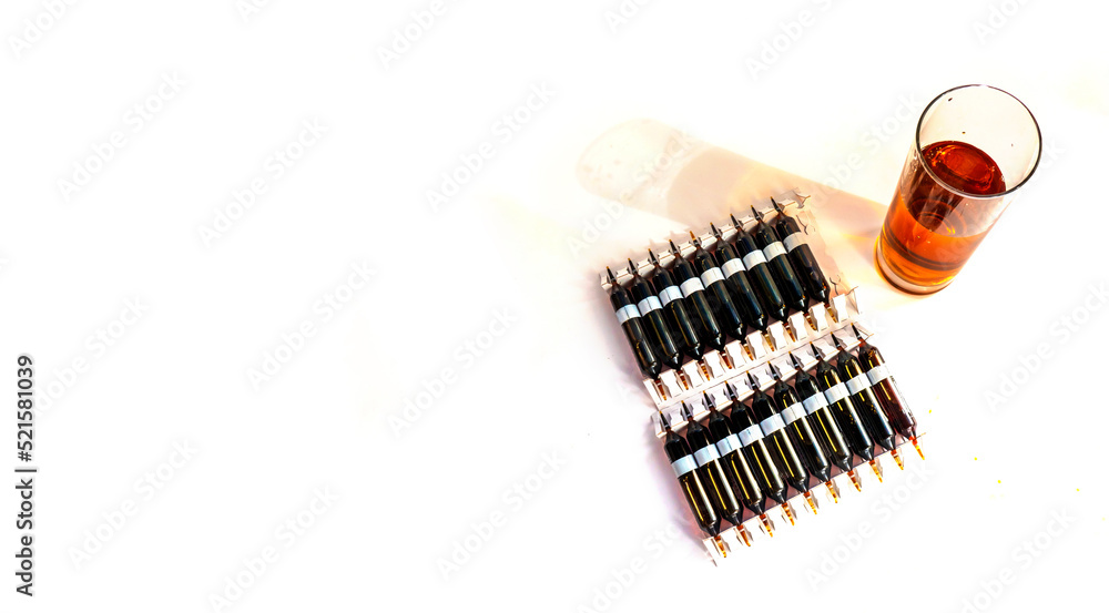 Group of ampoules with a transparent medicine in medical laboratory. lot of ampoules on light background. banner with copy space Group of ampoules with a transparent medicine in medical laboratory. lot of ampoules on light background. banner with copy space
