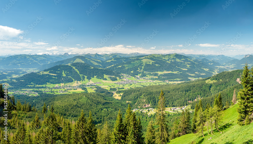 Panoramic landscape view from top of the mountain to the Wilden Kaiser valley city of Going