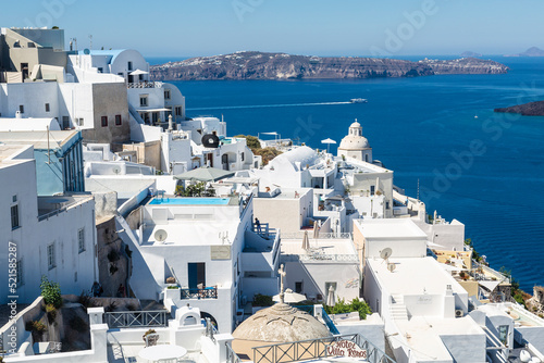 View of the city of Fira with snow-white buildings on the volcanic island of Santorini in the Aegean Sea. Greece