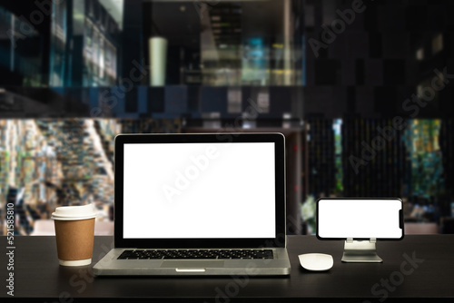 workspace with computer, laptop, office supplies, and coffee cup, smartphone, and tablet at office. desk work concept.