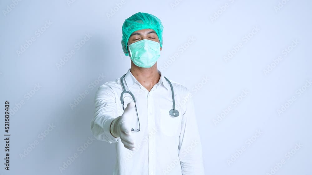 A male nurse asking for a hand shake gesture on a white background A male nurse asking for a hand shake gesture on a white background