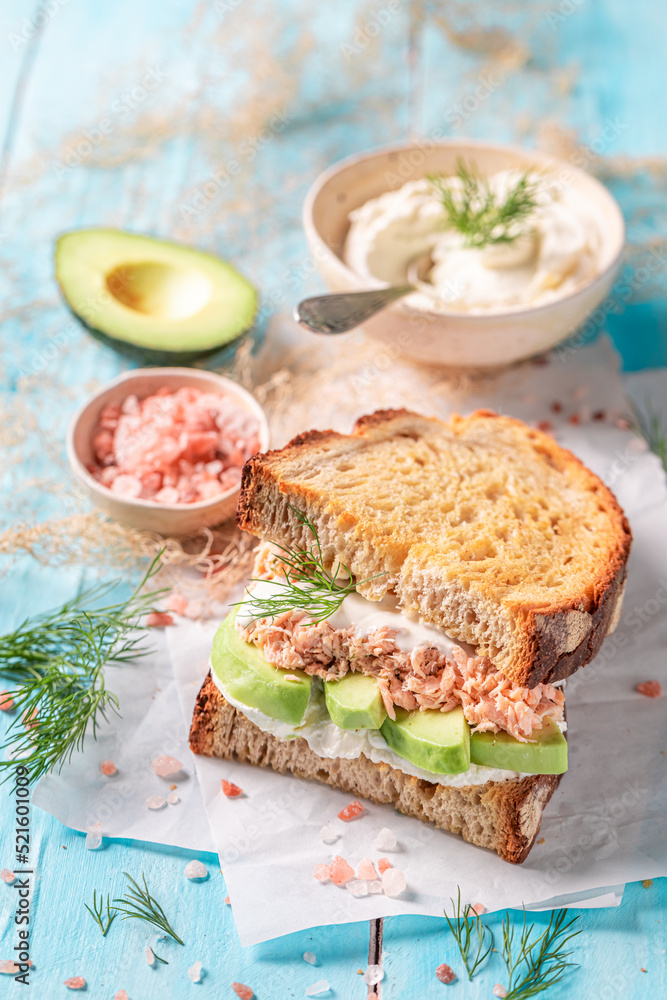 Homemade and tasty sandwich with salmon and avocado.