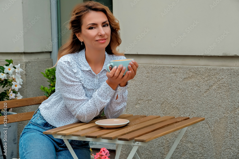 girl drinking coffee on the street. Street Cafe. beautiful girl and coffee. girl drinking coffee on the street. Street Cafe. beautiful girl and coffee.