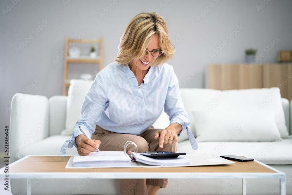 Senior Doing Finances Paperwork For Retirement Senior Doing Finances Paperwork For Retirement