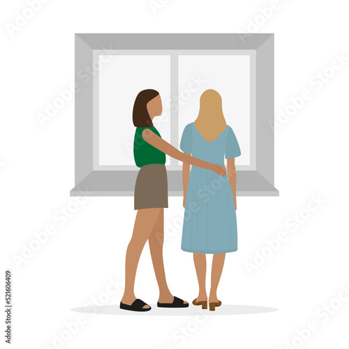 Two young women stand at the window and hug on a white background