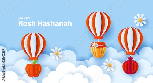 Rosh Hashanah jewish holiday banner design with paper cut hot air balloon, apple, honey and pomegranate. Vector illustration.