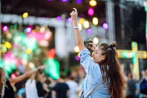 Сrowd with raised hands at music festival. Summer holiday, vacation concept.