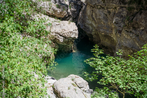 an emerald coloured river winds through a rocky gorge, the Anisclo Canyon, Ordesa National Park, Aragon Spain