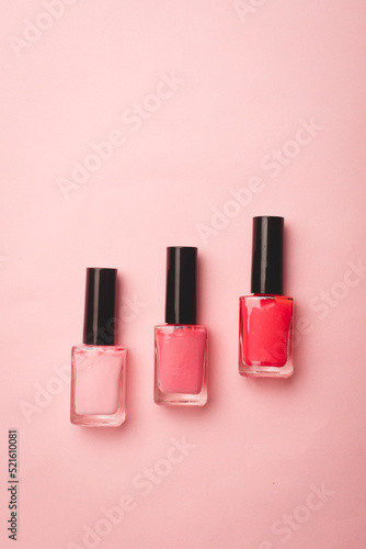 Pink nail polish on a pink copy space background. An article about nail polishes. Gel polish. An article about cosmetics. Decorative cosmetics . © alenka2194