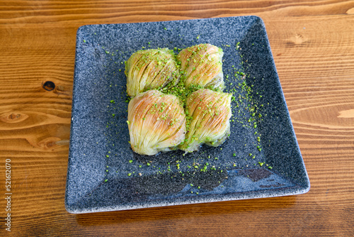 Pistachio baklava. Traditional Middle Eastern Flavors. Traditional Turkish baklava. Local name fistikli baklava photo