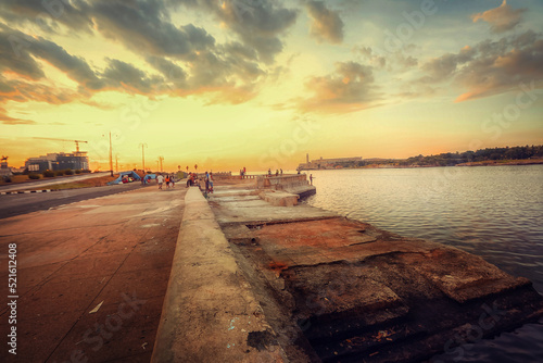 Sunset at Malecon, the famous Havana promenades where Habaneros, lovers and most of all individual fishermen meet, Havana, Cuba © AJITH.A
