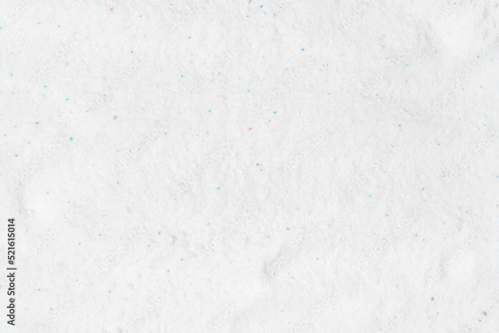 Obraz premium Laundry detergent for washing machines texture background. Washing powder. White wash powder with with colored granules