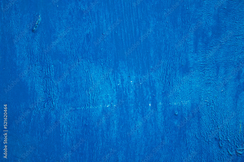Blue paint texture. The wall is painted blue.