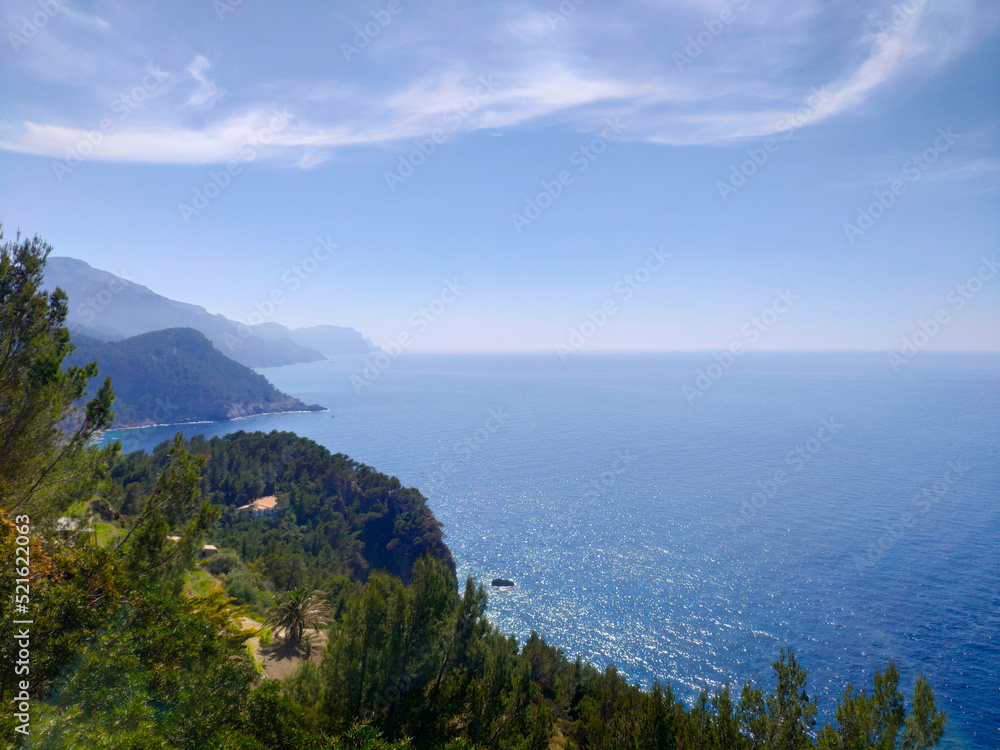 View of blue sea and coastal cliffs and Tramuntana mountains in Banyalbufar, Mallorca, Spain