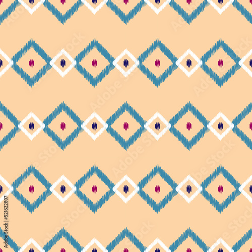 Abstract tribal geometric seamless pattern. Diamond ornament of beige, purple, blue, white colors. Embroidery imitation