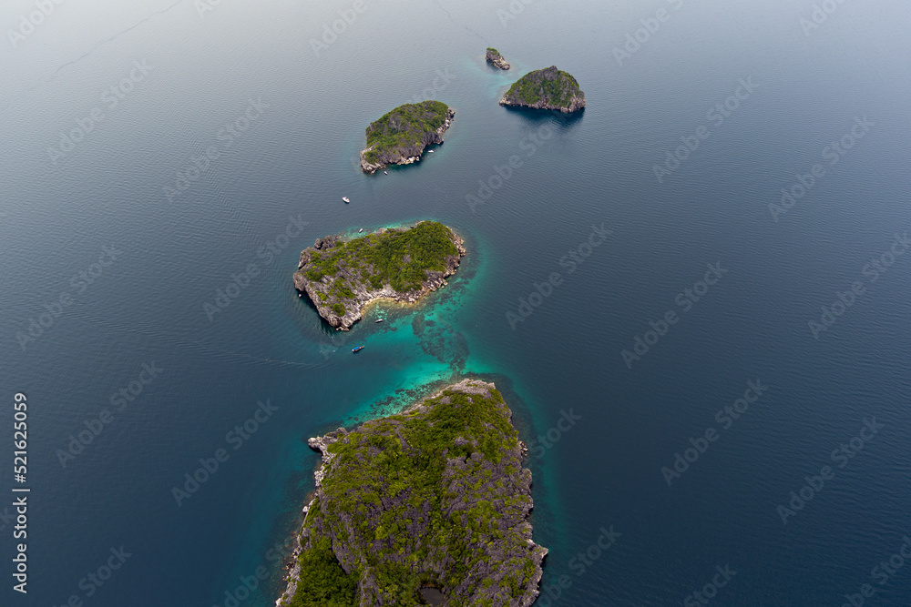 Ang Thong national marine park - small rocky islands in a row from a drone capture in southern Thailand from a high altitude Ang Thong national marine park - small rocky islands in a row from a drone capture in southern Thailand from a high altitude