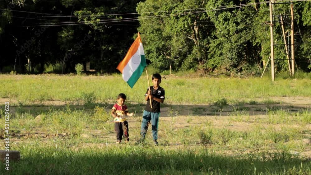 Two little Boys holding tri colour national Indian flag in the nature & waving flag in the air. Independence Day - Holiday and Republic Day
Two little Boys holding tri colour national Indian flag in the nature & waving flag in the air. Independence Day - Holiday and Republic Day