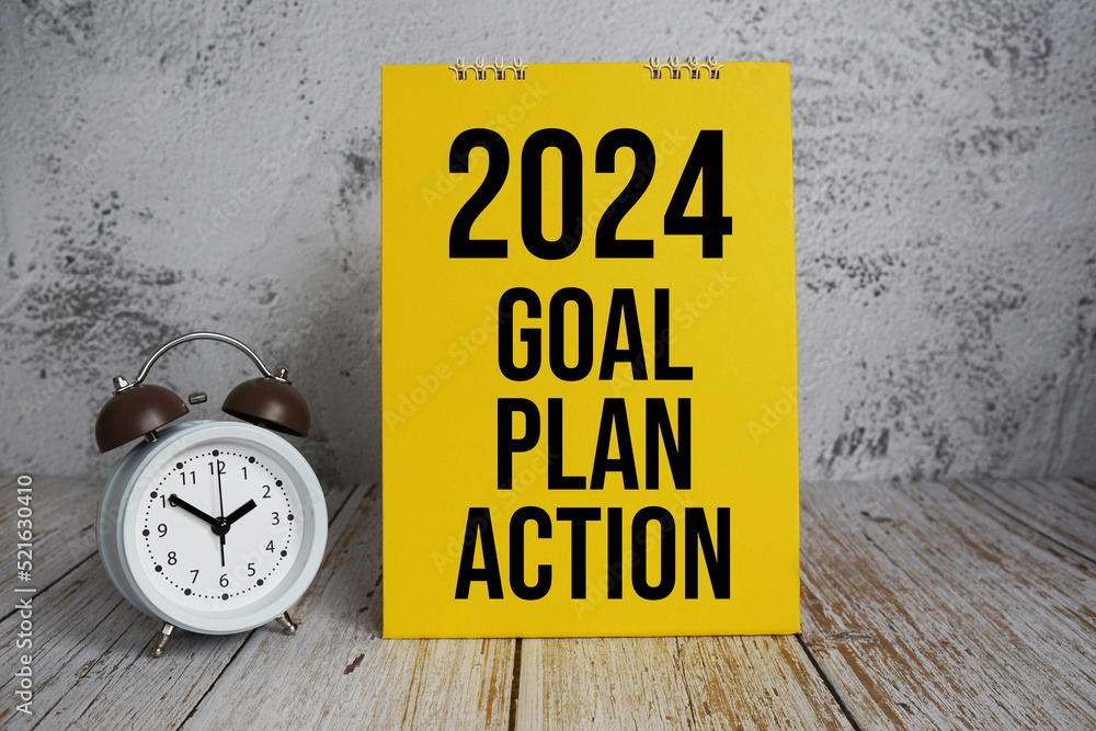 2024 Goal, Plan, Action text message and alram clock on wooden background  Stock Photo