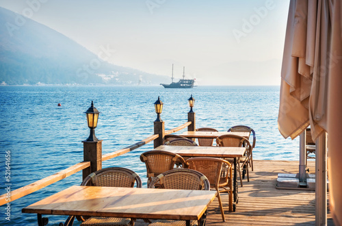 Ship and cafe tables on the beach, Marmaris, Turkey