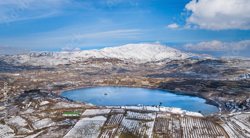 Aerial view of Lake Ram in wintertime with snow, Golan Heights, Israel. photo