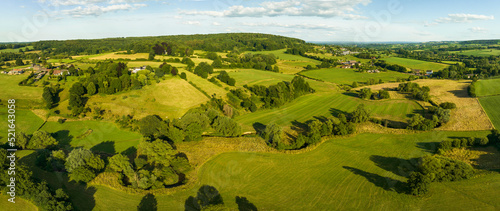 Aerial panorama of small river Geul in valley Geuldal with forest Elzetterbos, Zuid Limburg, Netherlands. photo