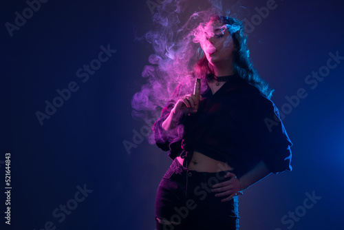 Woman with VAPE. Girl smoke...