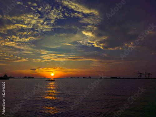 Dramatic photo of sunset sky with clouds. Dramatic photo of sunset over the sea