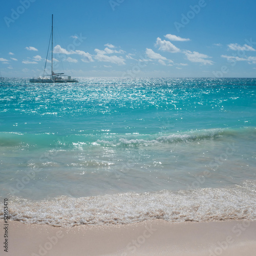 Beautiful sea, Caribbean Sea.tropical island, sailing yacht on the horizon