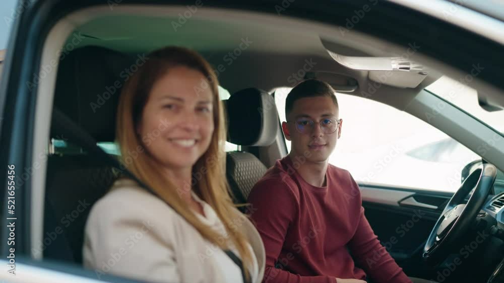 Man and woman mother and son holding key of new car at street Man and woman mother and son holding key of new car at street