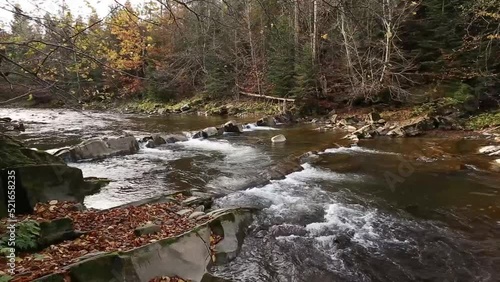 A magical river in the mountains, an autumn river, an autumn forest,a river in the mountains