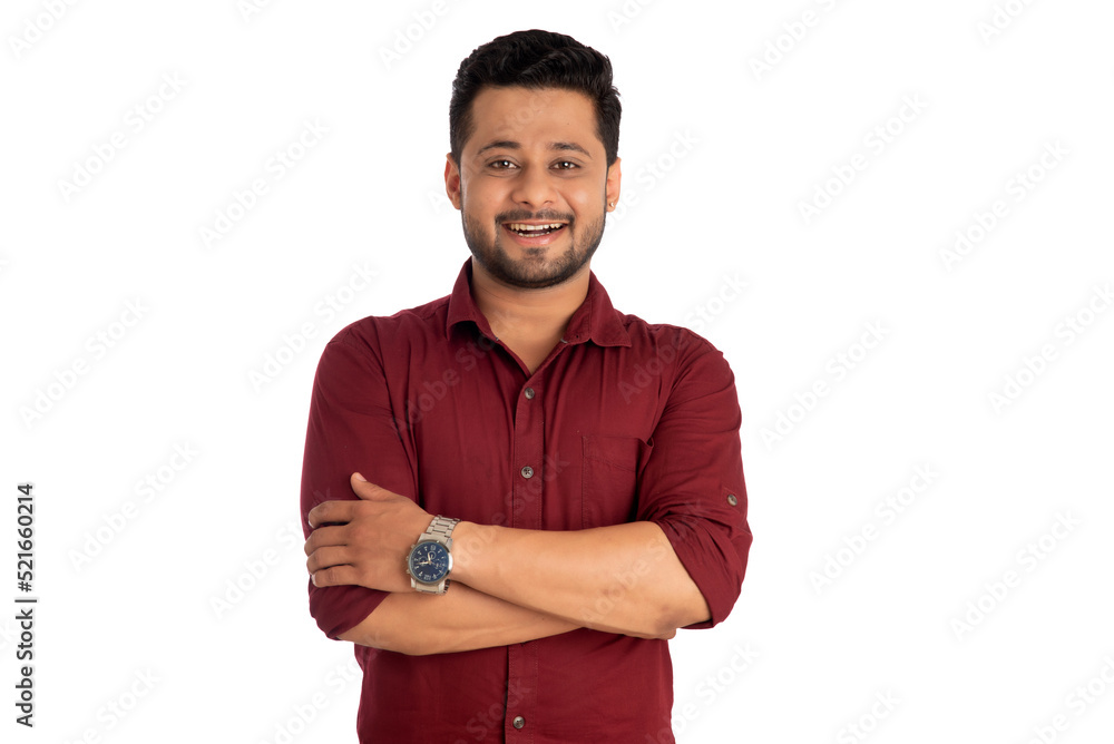 Portrait of a happy young man posing with arms crossed or hands folded on a white background Portrait of a happy young man posing with arms crossed or hands folded on a white background