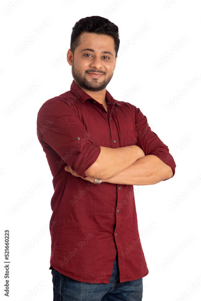 Portrait of a happy young man posing with arms crossed or hands folded on a white background Portrait of a happy young man posing with arms crossed or hands folded on a white background
