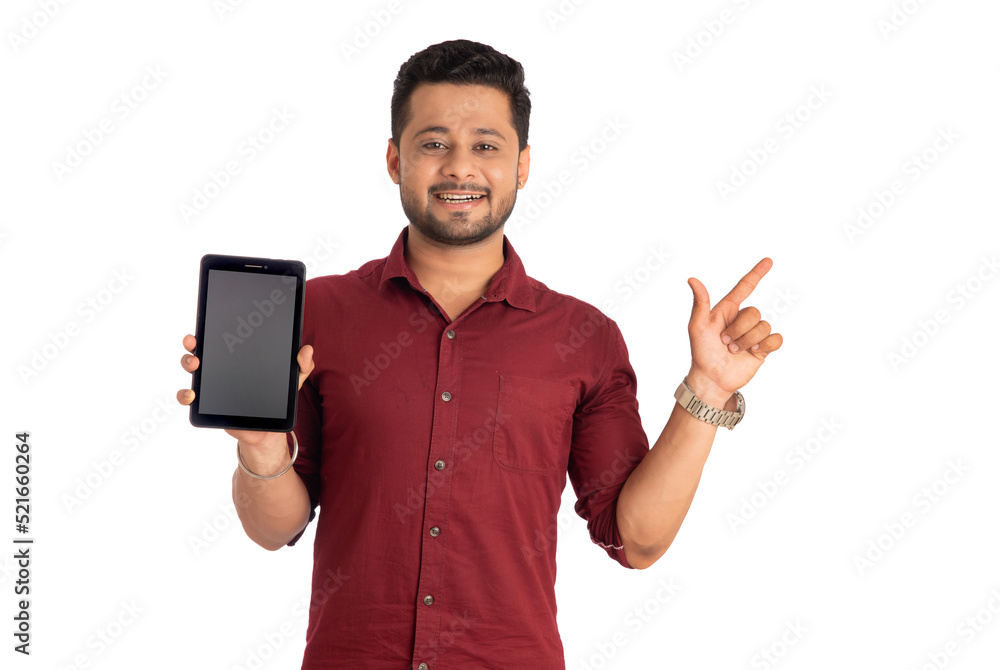 Young handsome man, businessman showing a blank screen of a smartphone or mobile or tablet phone on white background Young handsome man, businessman showing a blank screen of a smartphone or mobile or tablet phone on white background