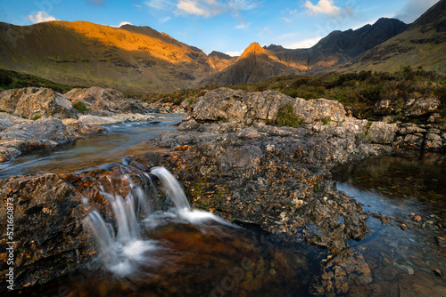 Popular tourist destination surrounded by dramatic mountains and waterfalls; The Fairy Pools, Isle of Skye, Scotland, UK.