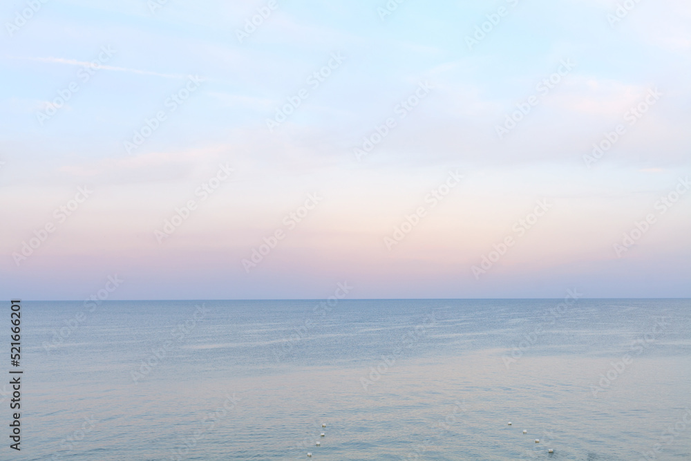 Sea side in sunset soft lighting. Soft horizon line before after sunset. Black sea beach