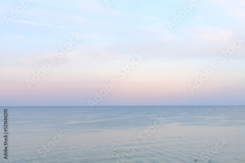 Sea side in sunset soft lighting. Soft horizon line before after sunset. Black sea beach