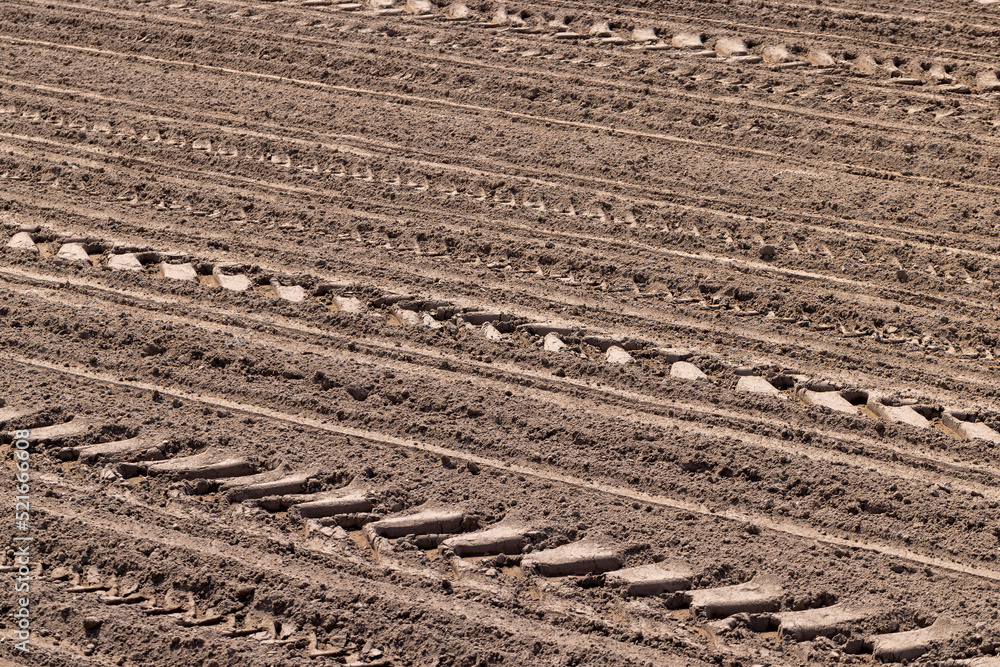 plowed soil in an agricultural field during tillage plowed soil in an agricultural field during tillage