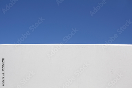 Blue sky and white wall background