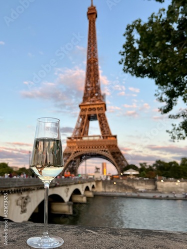 eiffel tower city and glass of white wine 
