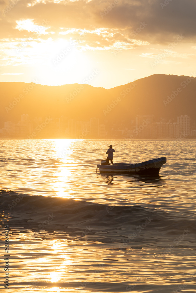 Fisherman at dawn, Acapulco Bay, Mexico